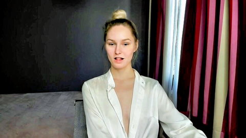 EvaMooni blonde beauty in open white blouse teasing cleavage
