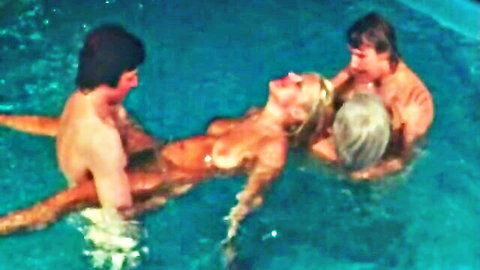 Vintage 1970s pool orgy with nude blonde woman and three men