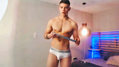 Muscular shirtless Asian twink teases bulge with metal rod in tight white Gordo briefs