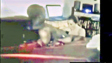 Blurry amateur webcam of black guy fucking white girl's pussy missionary on bed