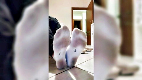 Amateur woman flashing her stinky white socked soles