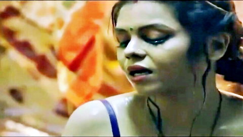 Seductive Indian woman in blue strapless top, intense gaze, Hindi web series scene