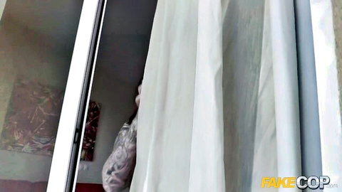 Curvy brunette with tattoos teases through window before blowjob and sex