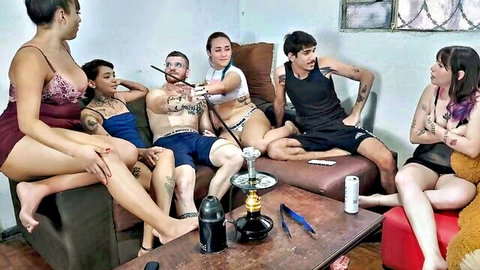 Tattooed mixed group in lingerie and underwear lounging with hookah, amateur party vibe