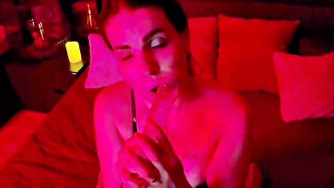 Redhead woman topless sucking sloppy on pink popsicle suggestively