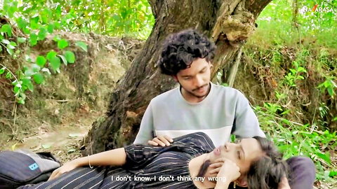 Intimate Malayalam couple outdoors, woman lying with man caressing her in Junior adult series