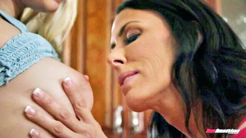 Reagan Foxx sucking blonde's big tits in steamy lesbian sofa action