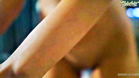 Close-up of nude Caucasian woman's arm and side torso in erotic pose