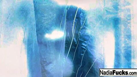 Abstract blue scene featuring Nadia White and Lily Cade in sexy action
