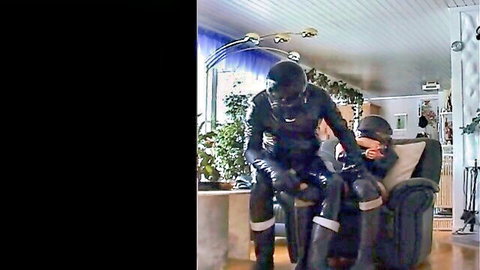 Kinky rubber couple in latex suits, intimate thigh touch pose