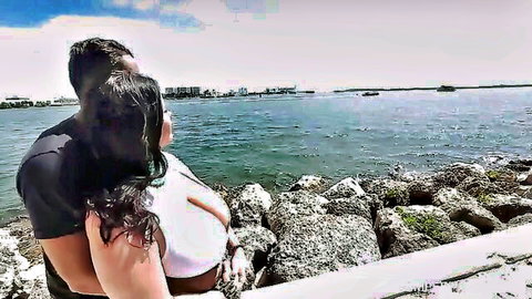 Angelina's big tits in white top, curvy couple embrace by ocean