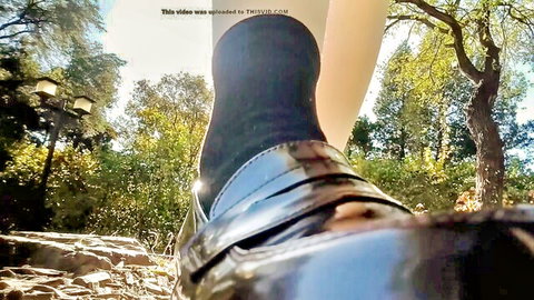 Giantess in black loafers and stockings towering in park, foot fetish POV