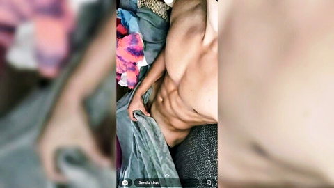 Muscular blonde jock lying down, hand gripping under sheet, toned abs visible