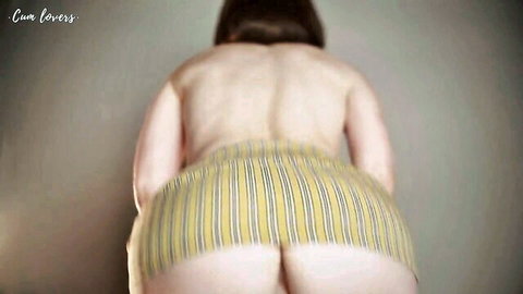 Curvy brunette bending over in striped panties pulled down, exposing big ass
