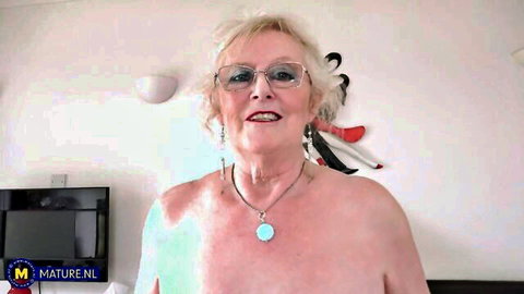Mature blonde Claire Knight topless with glasses in facesitting preview