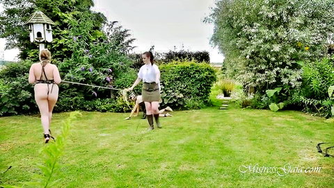 Femdom schoolgirl mistress leashes nude pet slave crawling doggystyle in garden exposing ass and pussy