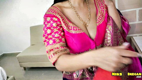 Indian Desi MILF in pink embroidered saree blouse with deep cleavage