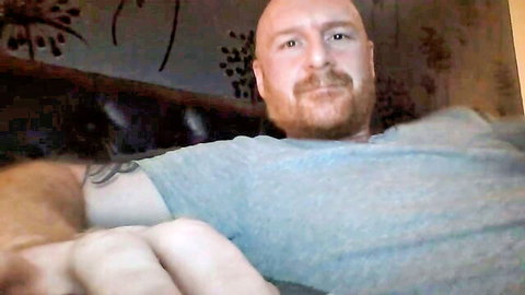 Bald ginger man with beard in t-shirt, preview for gay bottom foursome spanking video