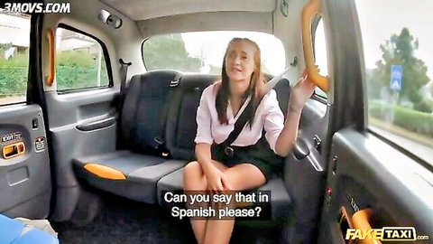 Gina Ferocious sexy Latina in Fake Taxi uniform, smiling in cab