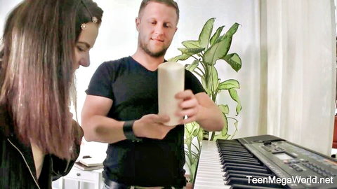 Lizi Vogue playful with guy holding candle in TeenMegaWorld babe video