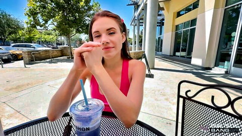 Rose Caarter in pink tank top sipping drink outdoors, teasing amateur style