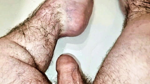 Hairy midget displays soles and masturbates near feet