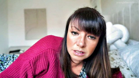 Yourgirlnextdoor1 as teasing step-mom in pink sweater on bed