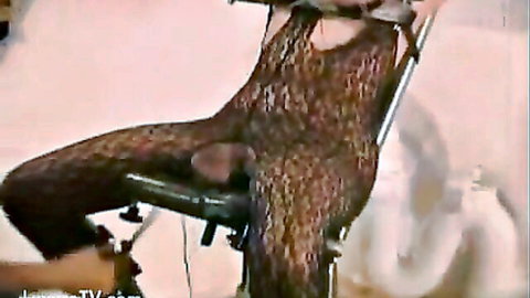 Bound woman in crotchless shiny bodysuit gets pussy pounded by fucking machine in intense bondage