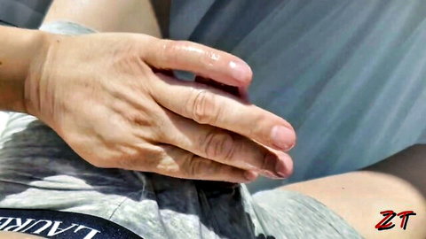 Close-up intense handjob on erect penis with glistening lube