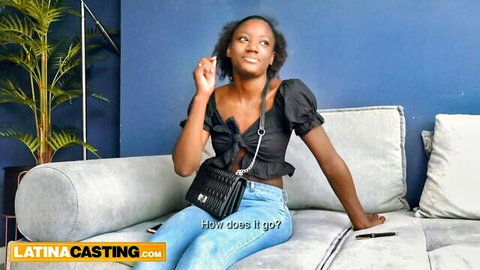 Skinny Black Latina in off-shoulder top and jeans, seductive casting pose