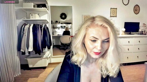 Blonde MILF teases big natural tits cleavage in open robe webcam solo