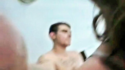 Amateur bathroom mirror selfie of shirtless hairy man with woman behind