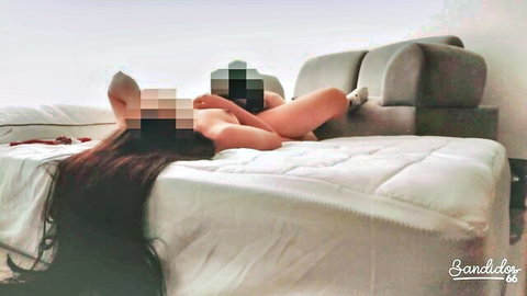 Censored nude Asian stepmom with long black hair lounging seductively on bed