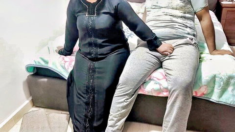 Madiha Egyptian in embroidered black dress with man on bed