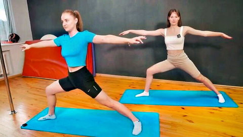 Alina and yoga partner in flexible warm-up poses, tight outfits for beginners