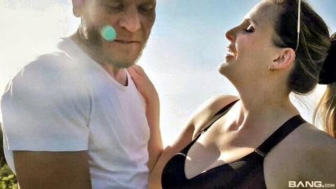 Passionate white couple embracing outdoors in sunny yard
