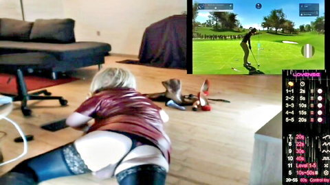 Wicki von Trannyston blonde trans in red latex top, stockings, exposing ass while gaming