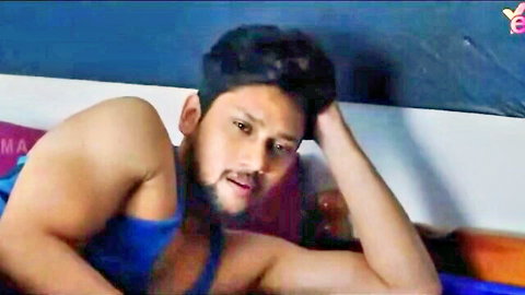 Muscular Indian man in blue tank top, seductive pose from Diwane Paer Yessma hot series