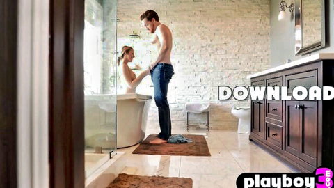 Lily Larimar in bathtub gazing at man's open jeans bulge