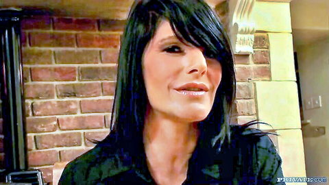 Seductive brunette with bangs pouting plump lips teasingly closeup