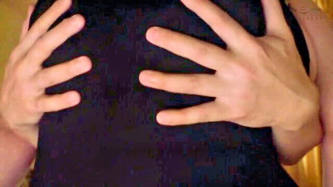 Blonde woman's large breasts cupped by hands in black top teaser