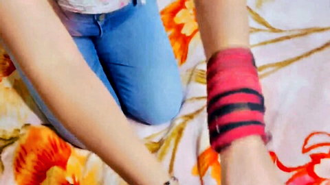 Mahi652288 in white top and blue jeans kneeling seductively