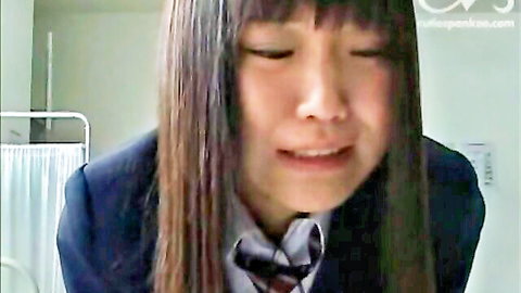 Crying Japanese schoolgirl in navy uniform close-up, emotional expression