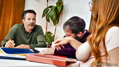 Redhead teen in glasses leans over tutor in seductive study scene