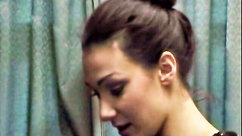 Brunette young lady in profile, serious expression, implying discipline scene