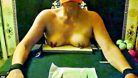 Bound blonde in intense BDSM nipple nailing torture