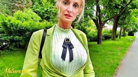 Mazzy Leggz blonde MILF in green blazer flashing legs in park