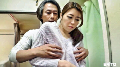 Older Japanese man gropes petite East Asian girl's small tits from behind over sweater in bathroom