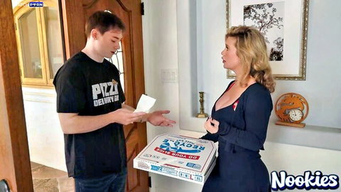 Andie Anderson in low-cut blue dress flirting with pizza delivery guy at door