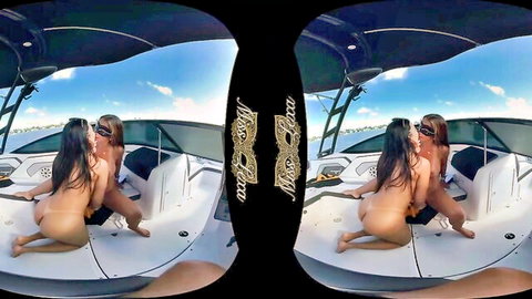 Two topless brunettes with big tits and asses kissing intimately on sunny yacht deck